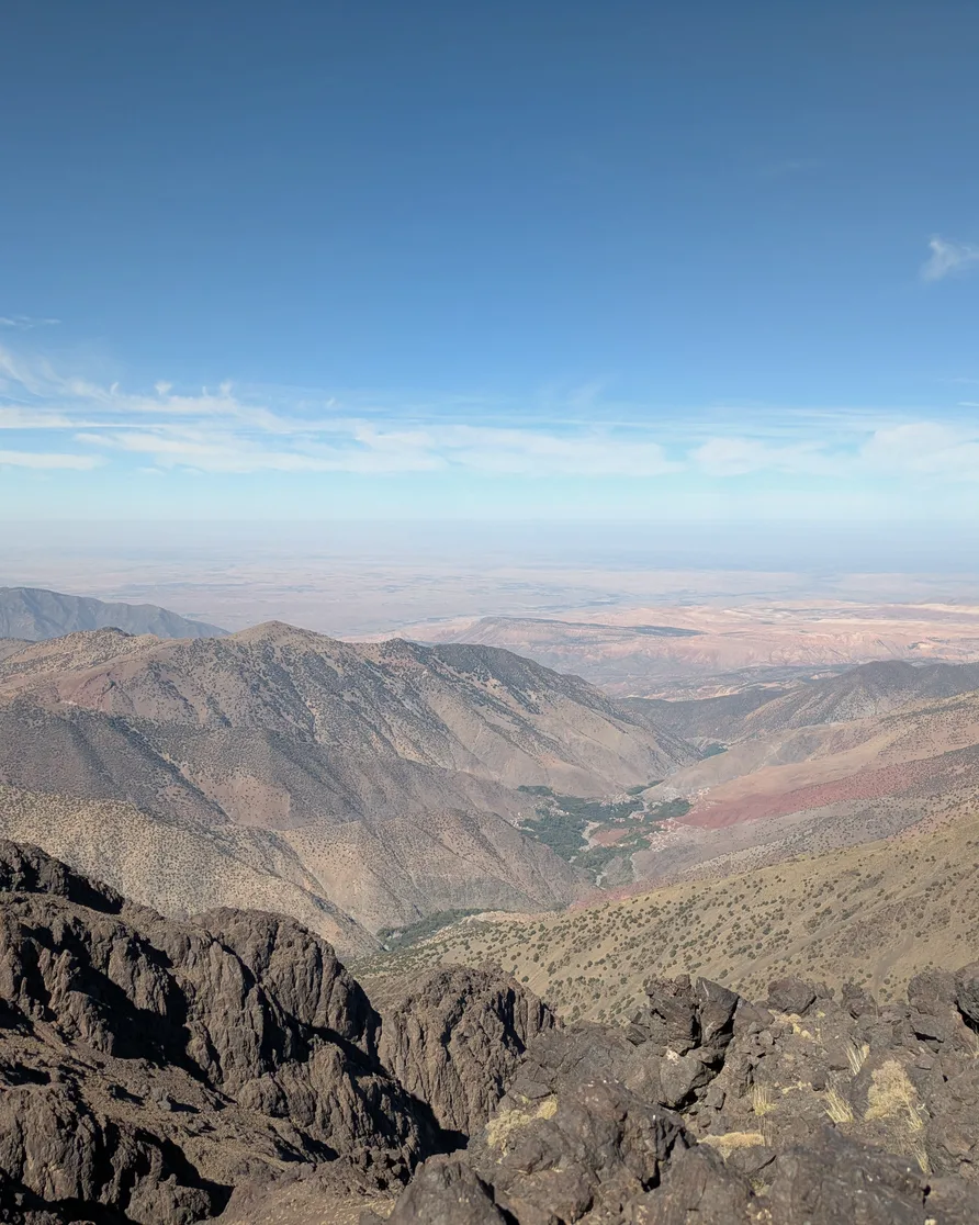 Ridges of the High Atlas falling away to a distant plain, seen from Toubkal